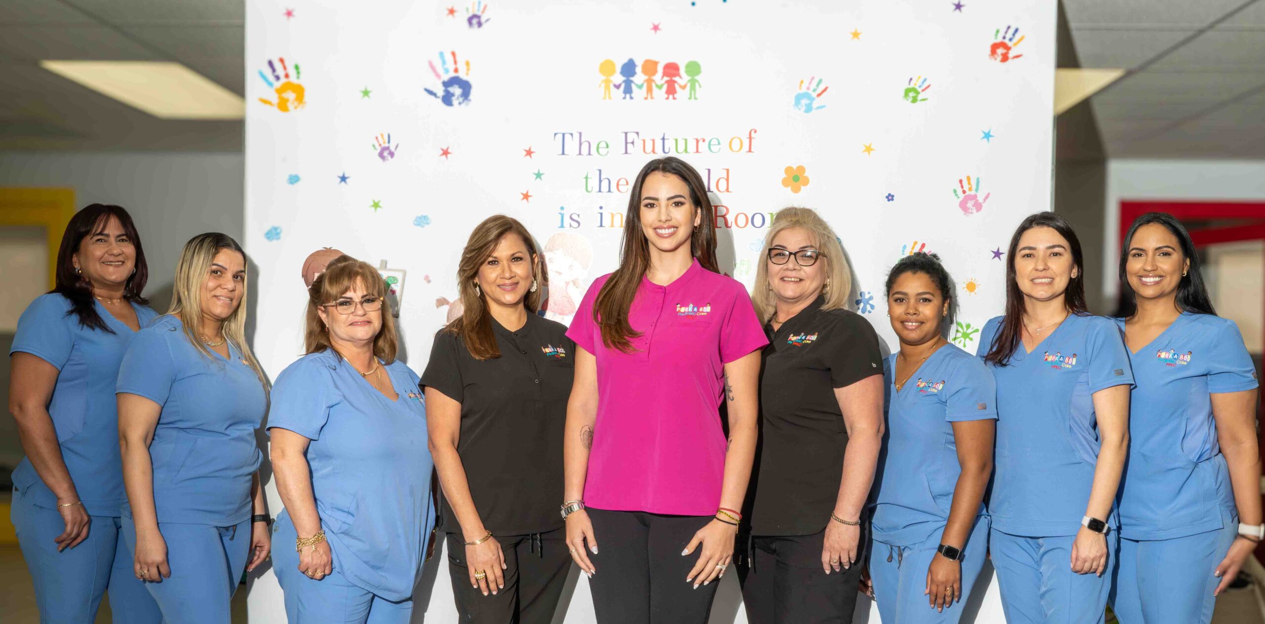 Group photo of the Peek A Boo Pediatric Care team in Hollywood, Florida.